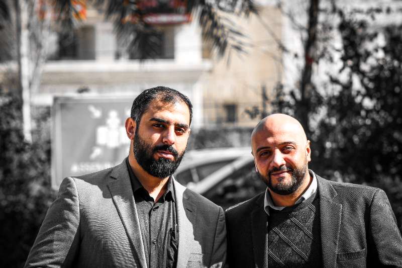 Black and white portrait of two friends