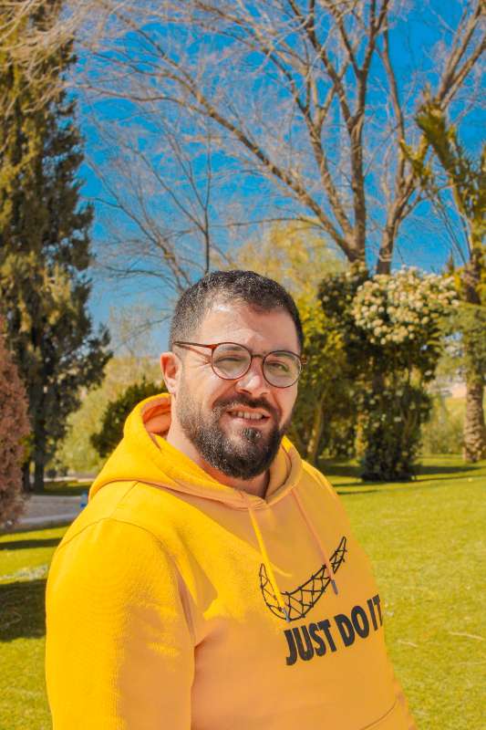 Portrait in a yellow hoodie, outdoors